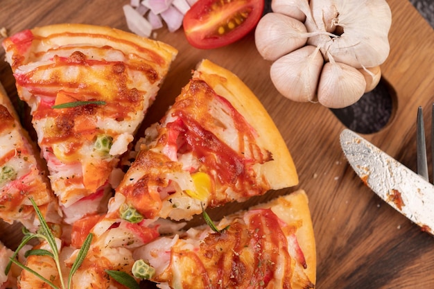 pizza placed on a wooden plate