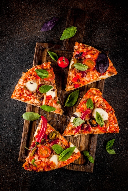 Pizza and red wine on dark background 