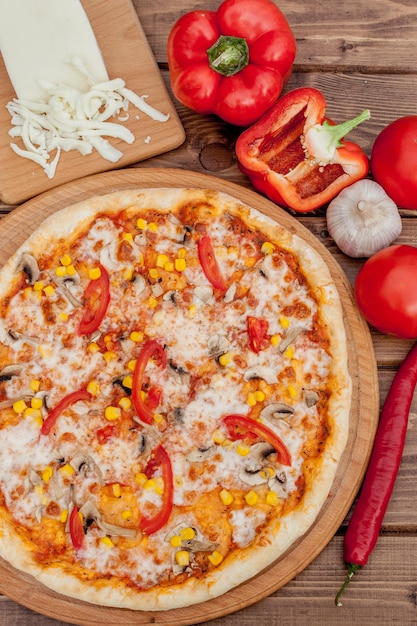 Pizza and red wine on wooden table background Top view with copy space