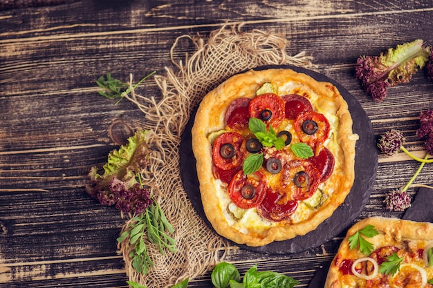 Pizza on rustic wooden table 