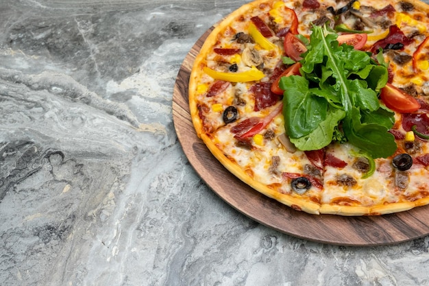 Pizza served on wooden plate