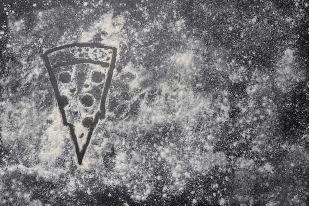 Photo pizza shape made with flour on grey table with copy space