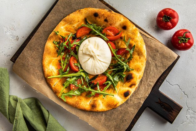 Pizza and tomato on a grey background Fresh Homemade Italian Pizza Italian food delicious