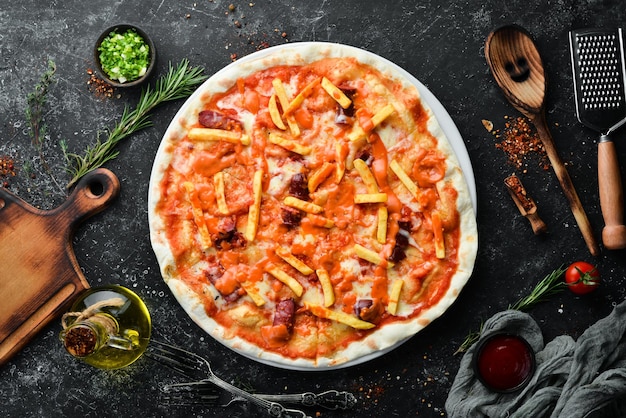 Pizza Traditional pizza with sausages and french fries Top view Free space for your text