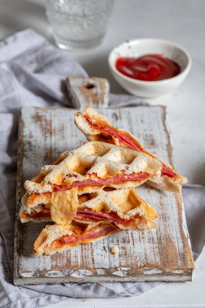 Pizza waffle toast with ham, pepperoni and cheese