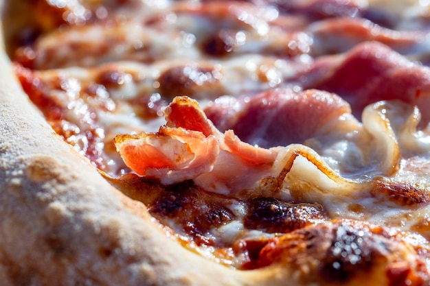 Pizza with bacon and cheese for sale at the street food market in island Koh Phangan Thailand Closeup