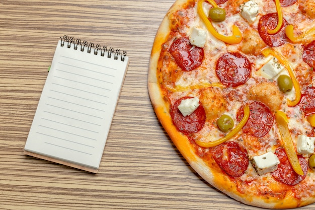 Pizza with blank paper with copy 