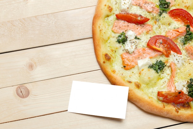 Pizza with blank paper 