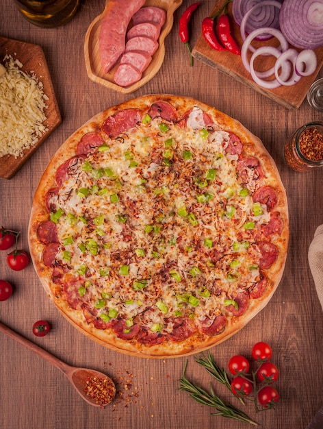 Pizza with calabrese sausage, mozzarella cheese, onion and green bell pepper