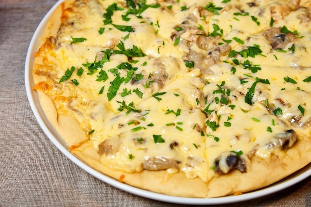 Pizza with cheese mushrooms and herbs