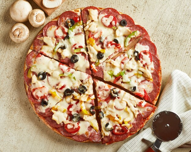 Pizza with cheese, tomato and olives