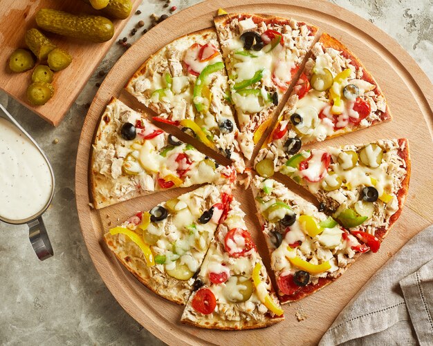 Pizza with cheese, tomato and olives