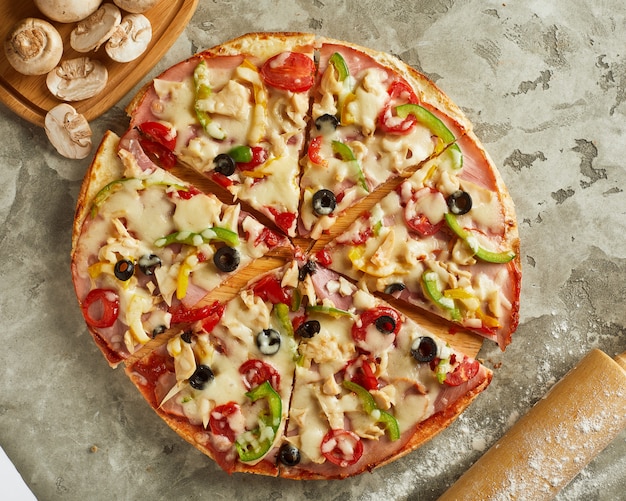Pizza with cheese, tomato and olives
