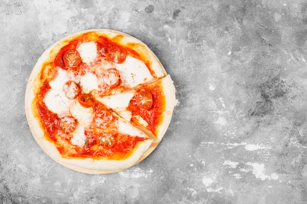 Pizza with cheese, tomatoes and basil 