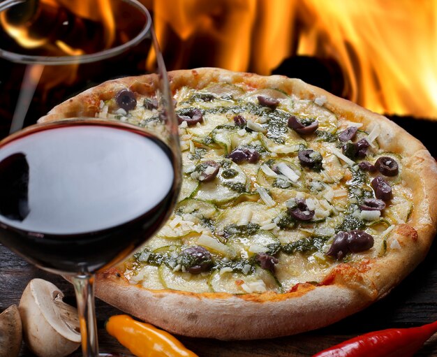 Pizza with glass of red wine