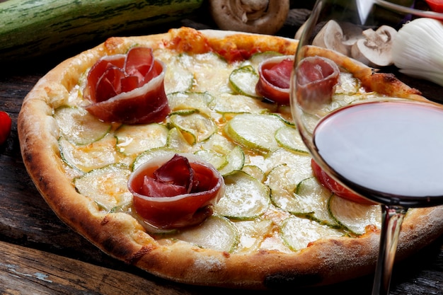 Pizza with glass of red wine