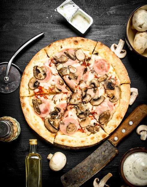 Pizza with ham, mushrooms and cheese.