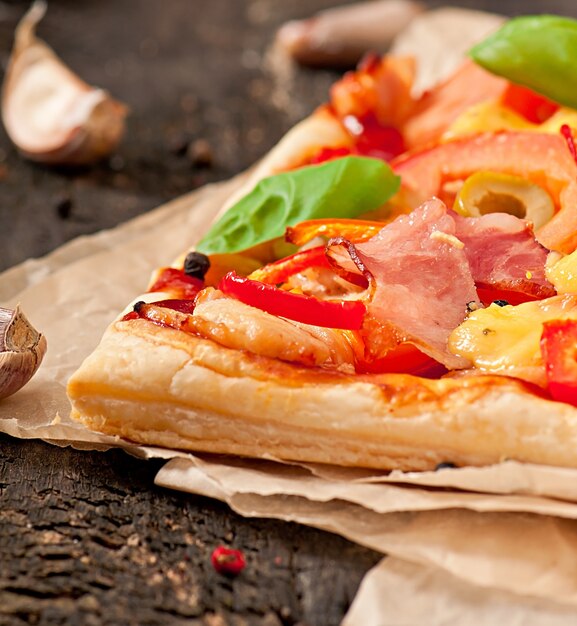 Pizza with ham, pepper and olives