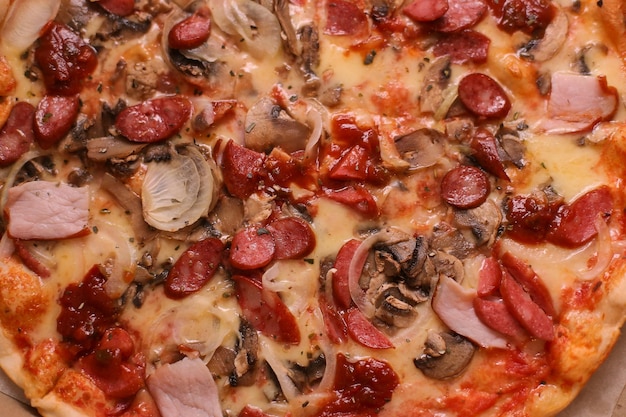 Pizza with ham pork salami pepperoni Bavarian sausages mushrooms