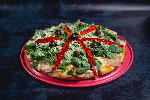 Pizza with many ingredients on a table fast food restaurant