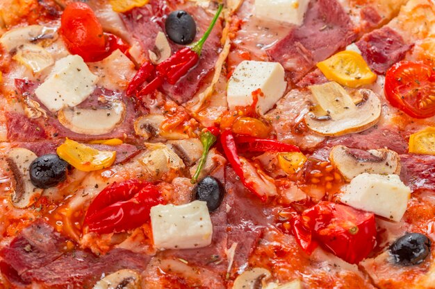 Pizza with Mozzarella, Ham, Cherry Tomatoes, Black Olives