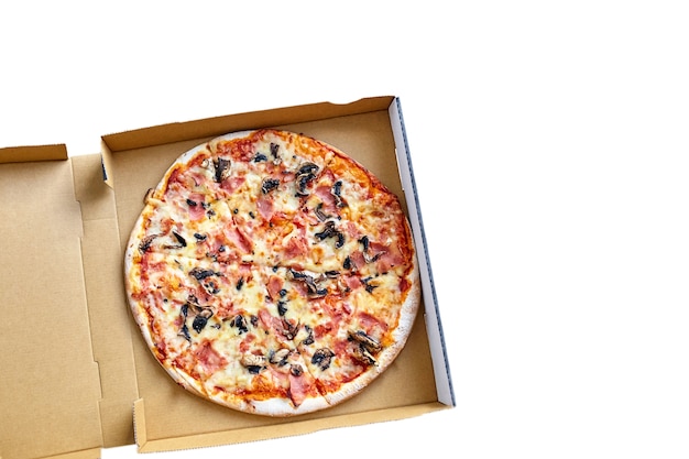 Pizza with mushrooms, cheese and ham in a carton box isolated