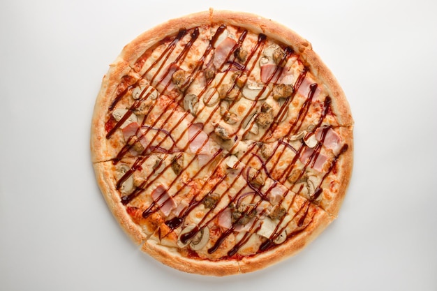 Pizza with mushrooms ham bacon teriyaki sauce and cheese on a white background