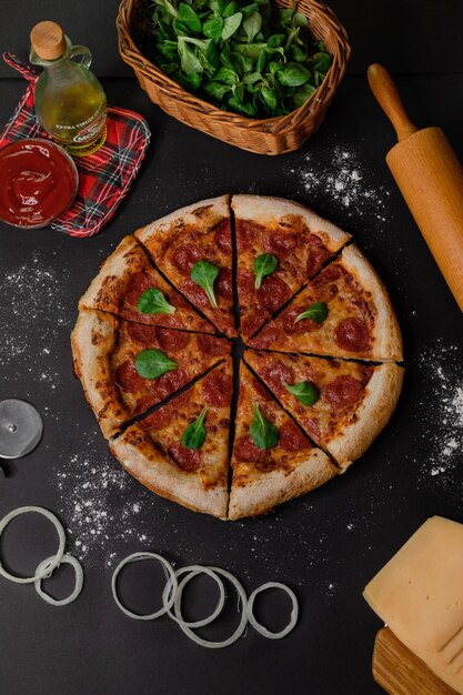 A pizza with a pizza cutter on it