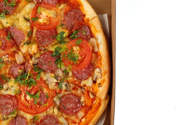 Pizza with sausage in a box on a white isolate Hot Pizza in an open cardboard boxnd