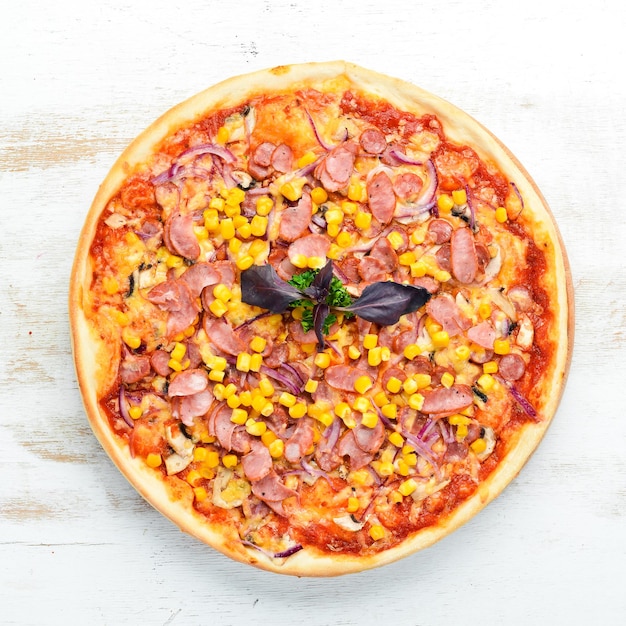 Pizza with sausage and corn Top view free space for your text Rustic style