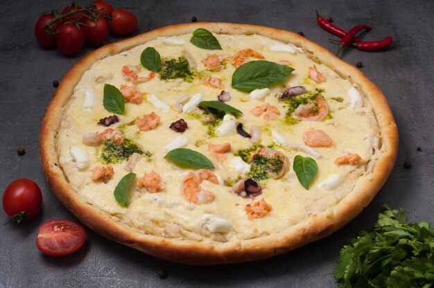 Pizza with seafood: shrimp, squid, salmon and cream cheese