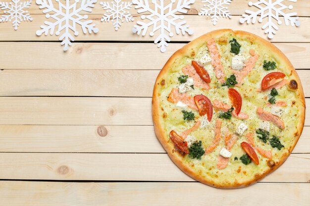 Pizza with snowflakes decoration. Winter pizza