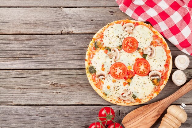 Pizza with tomatoes and mushrooms