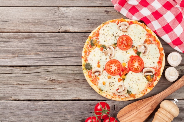 Pizza with tomatoes and mushrooms