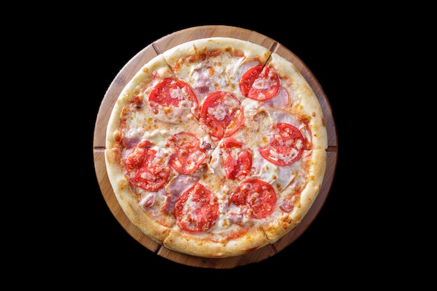 Pizza on a wooden board on a black background