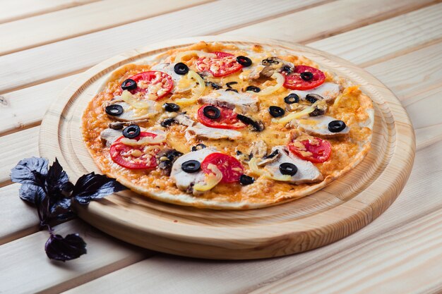 Pizza on the wooden table top view