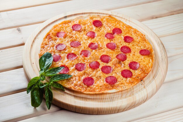 Pizza on the wooden table top view