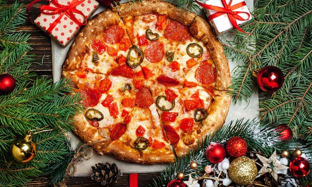 Photo pizza on wooden table with ingredients