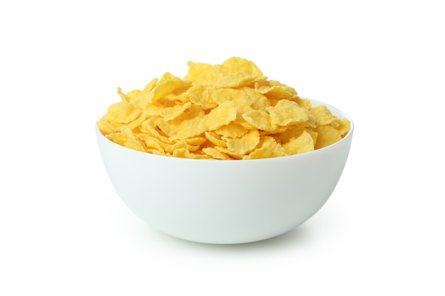 Plaat van droge ongekookte cornflakes geïsoleerd op wit