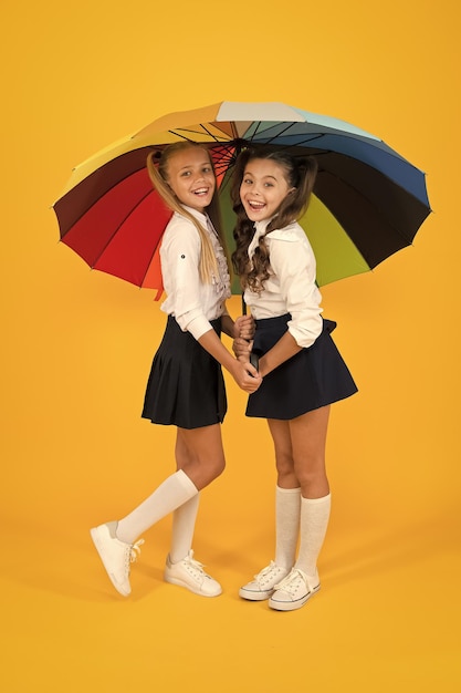Place for both of us fashion accessory girls friends with umbrella rainy day happy childhood school time rainbow umbrella colorful life schoolgirls happy big umbrella fall weather forecast