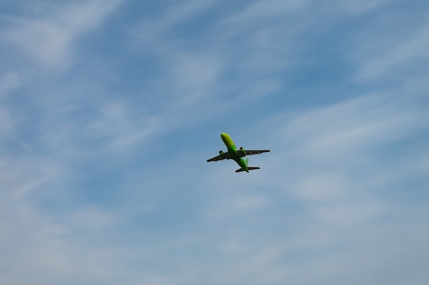 Place flying in sunset sky.