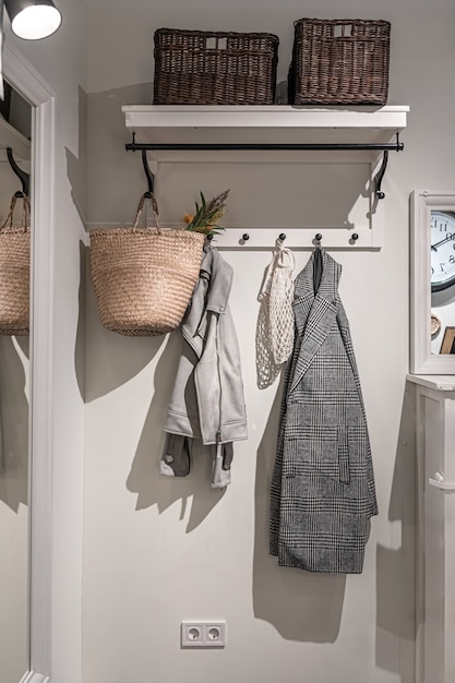 Photo place for outerwear in the hallway, hooks for hanging, home interior.