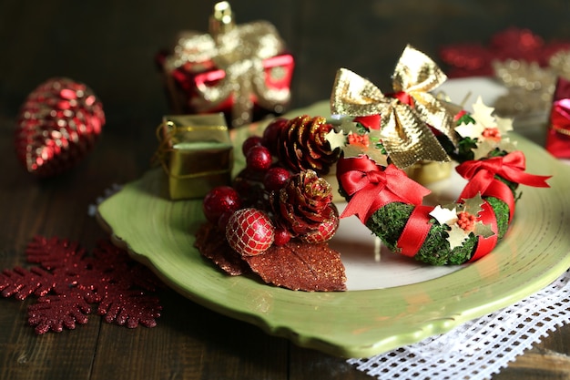 Place setting for Christmas, on wooden background