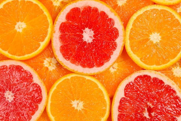 Plakjes sinaasappels en grapefruits als achtergrond