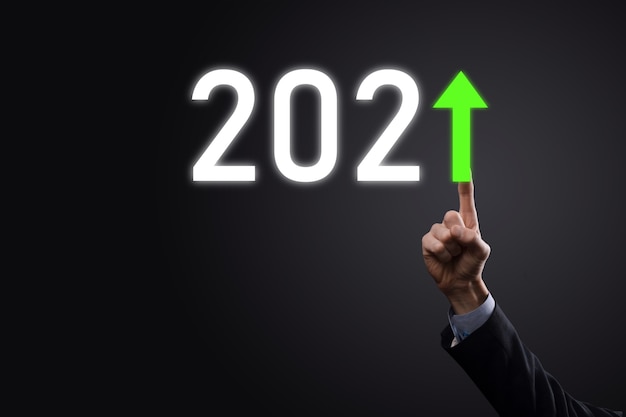 Plan business positive growth in year 2021 concept. Businessman plan and increase of positive indicators