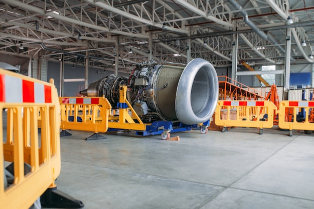 Plane engine without covers, maintenance in hangar