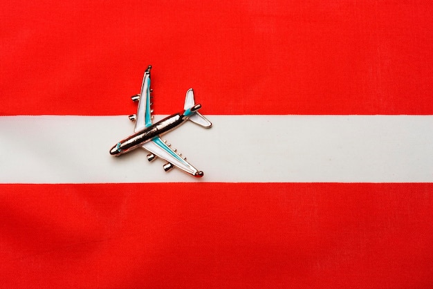 Plane over the flag of Austria the concept of travel and tourism