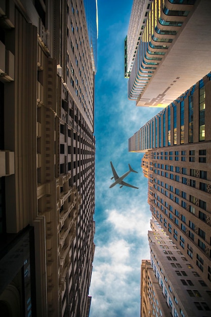 Plane flies over the city over New York