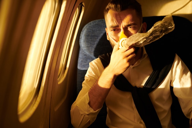 Plane Passenger with Oxygen Mask