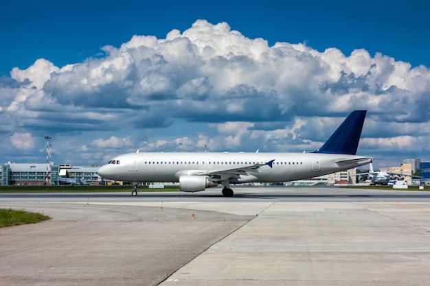 Plane on the runway with a beautiful textured sky